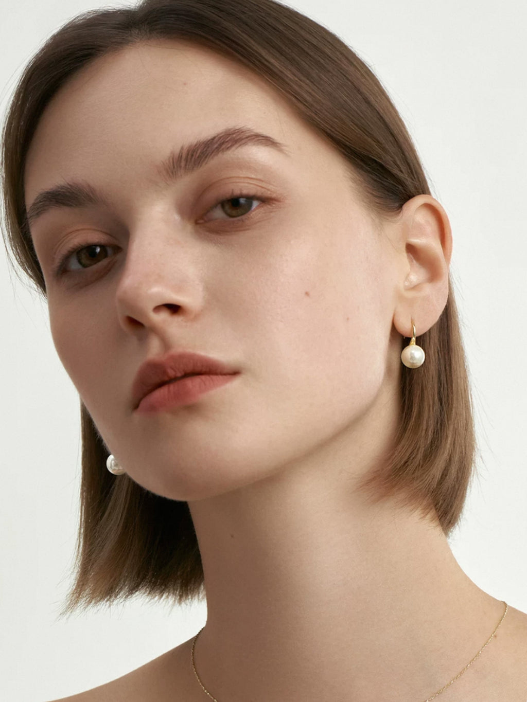 Pendientes de perlas doradas